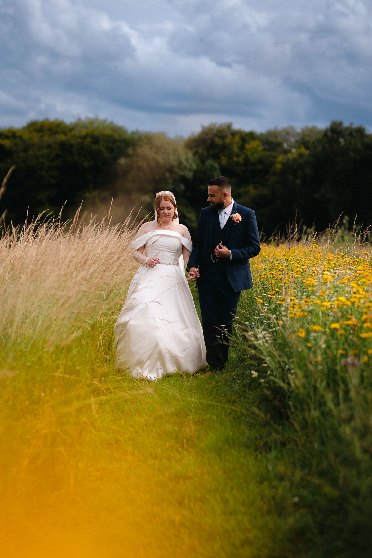 Bride and Groom at Alter in woodland setting kissing