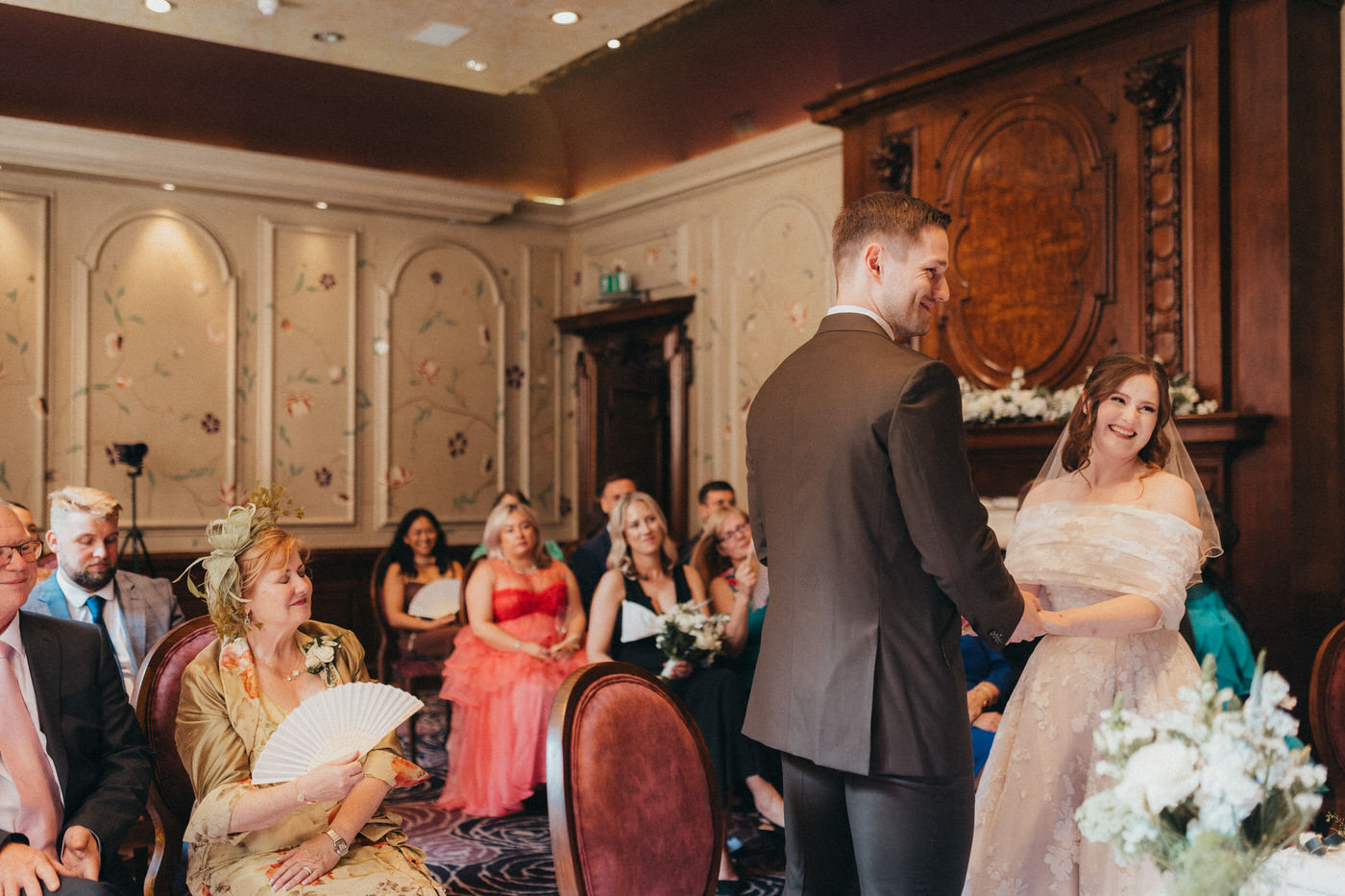 Reading Modern Wedding Photography - Couple on wedding day, with dog holding a rainbow umbrella