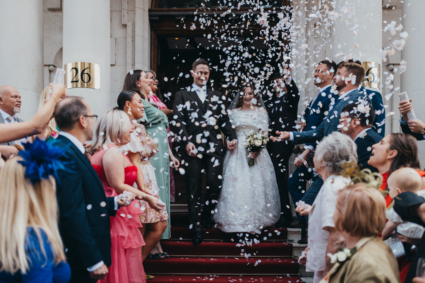 Reading Modern Wedding Photography - Couple on wedding day, with dog holding a rainbow umbrella